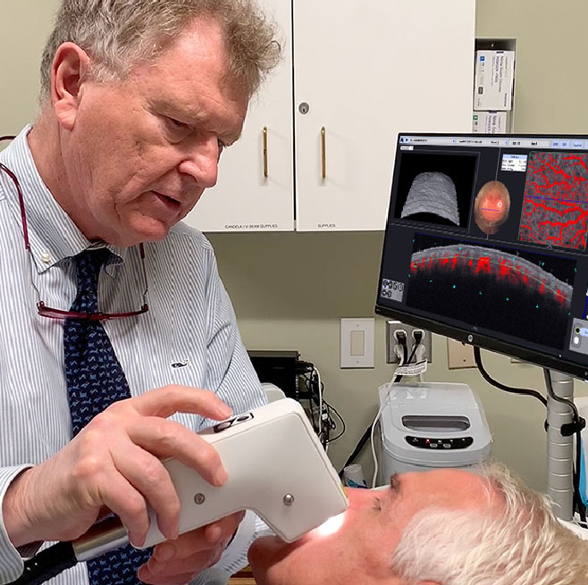 Professor Christopher Zachary, University of California, Irvine, scanning a patient with VivoSight OCT
